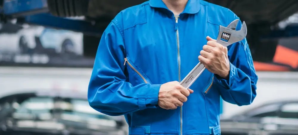 ASE-certified Premier Automotive technician servicing a vehicle
