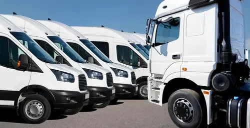 Commercial fleet vehicles lined up for scheduled maintenance